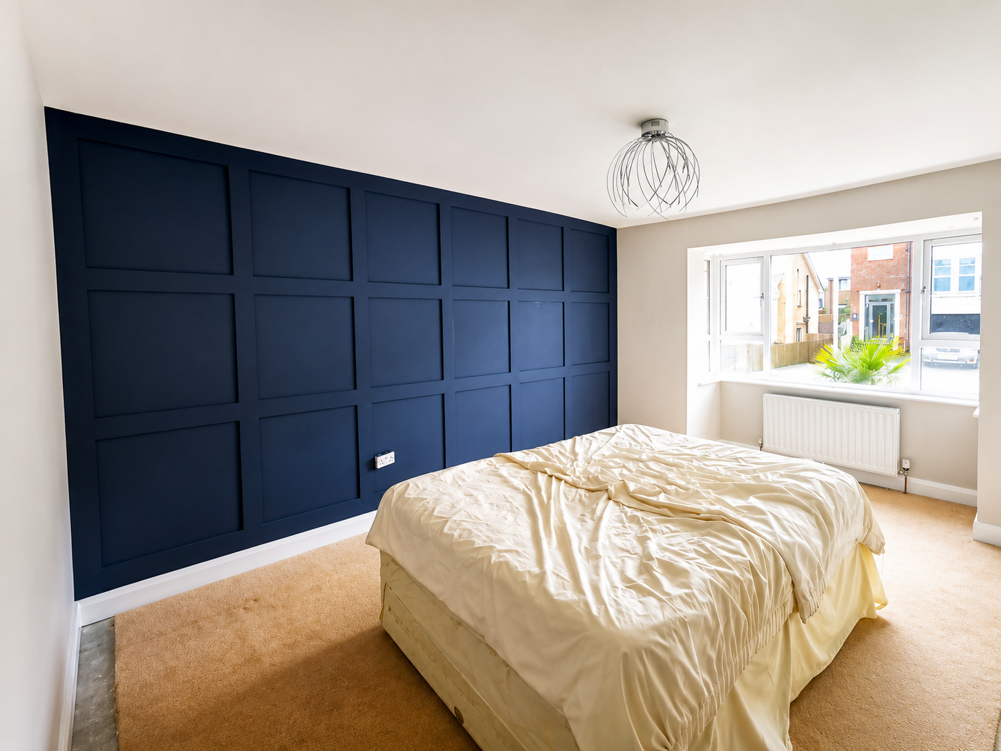 Painted bedroom feature wall panelling